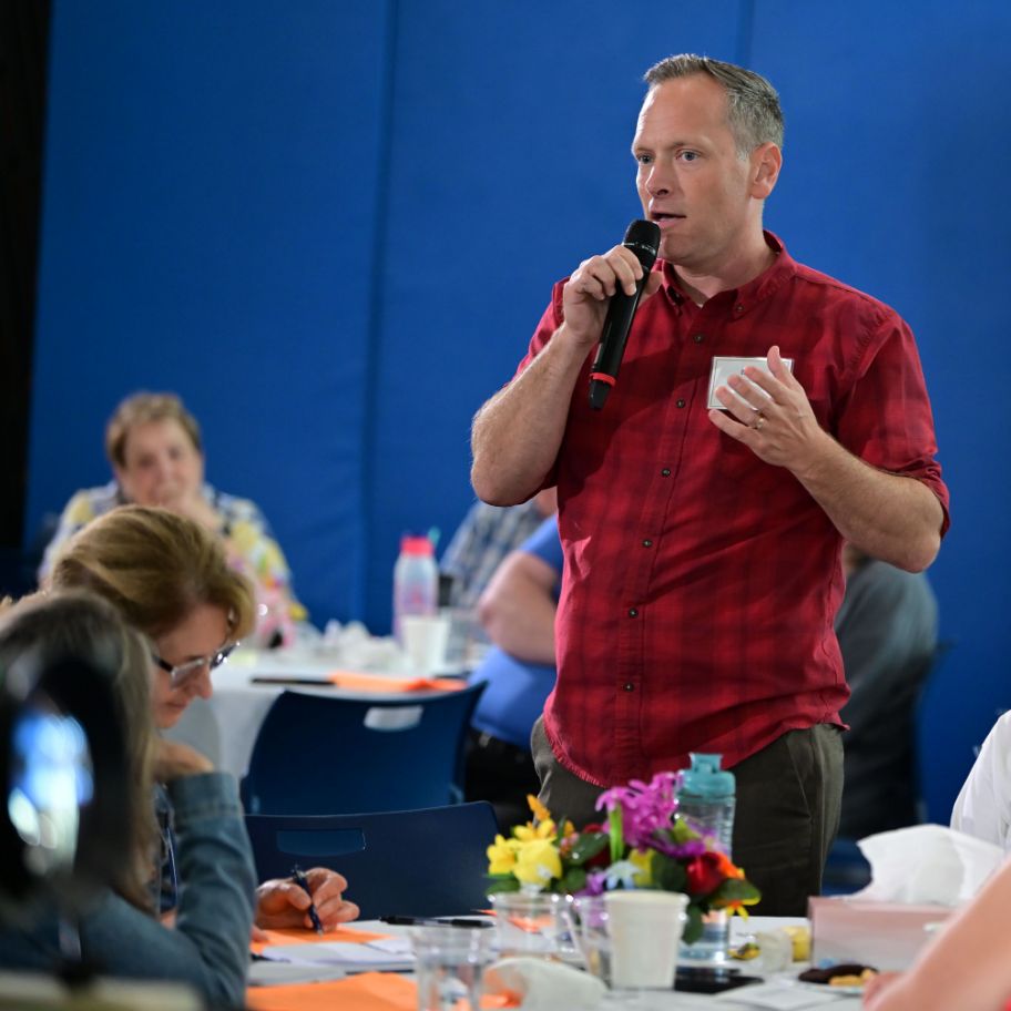 Christlife pastor speaking at table