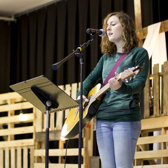 christlife woman playing guitar